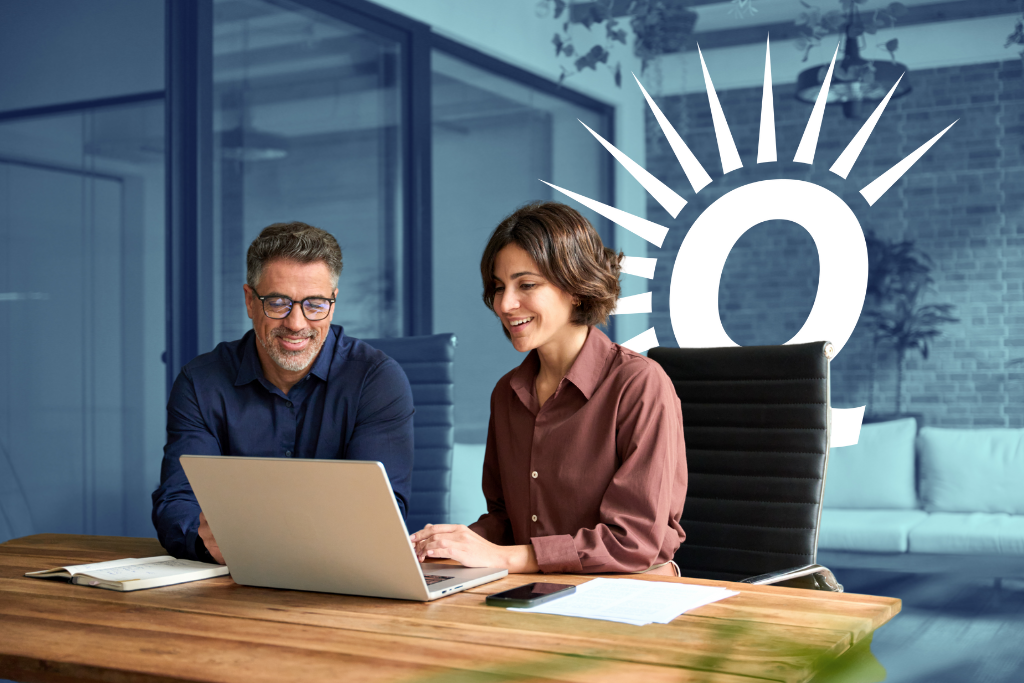 Two people at laptop